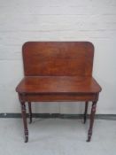 A Victorian mahogany turnover top tea table