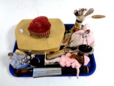 A tray containing cased manicure set, hand fans, plated shoe pin cushion,