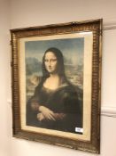 A gilt framed colour print depicting the Mona Lisa,