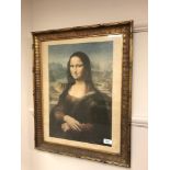 A gilt framed colour print depicting the Mona Lisa,