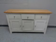 A contemporary oak topped sideboard