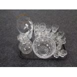 A tray containing assorted glassware to include decanter, assorted drinking glasses, vase,