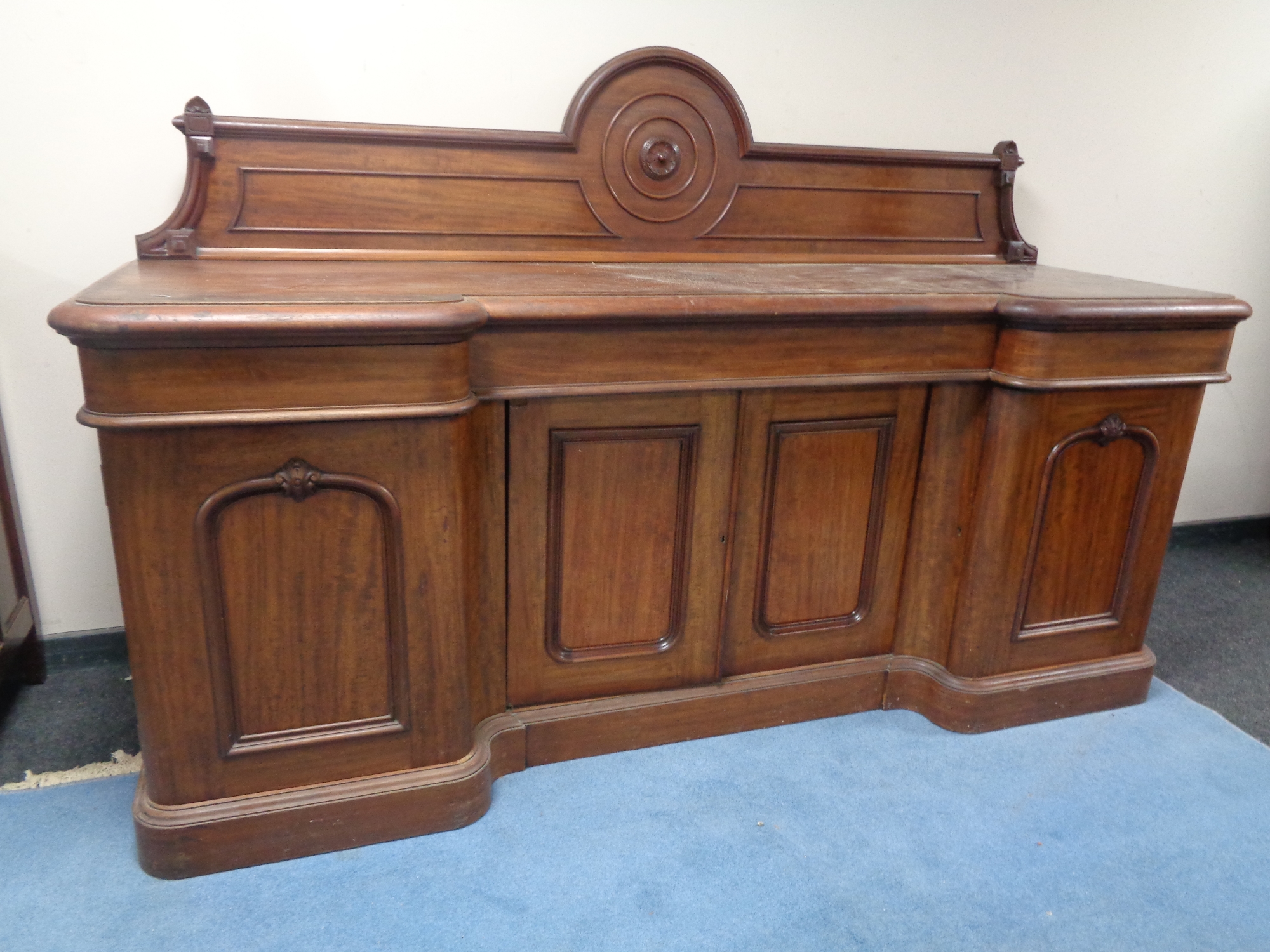 A Victorian mahogany inverted breakfront sideboard