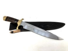 A Down Under Knives 'Toothpick' knife in leather sheath.