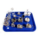 A tray containing five assorted silver rimmed vases, bottles and salts,