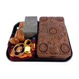 A tray containing carved eastern trinket box, pewter embossed card box, Bakelite napkin rings,