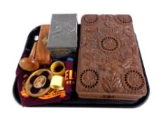 A tray containing carved eastern trinket box, pewter embossed card box, Bakelite napkin rings,