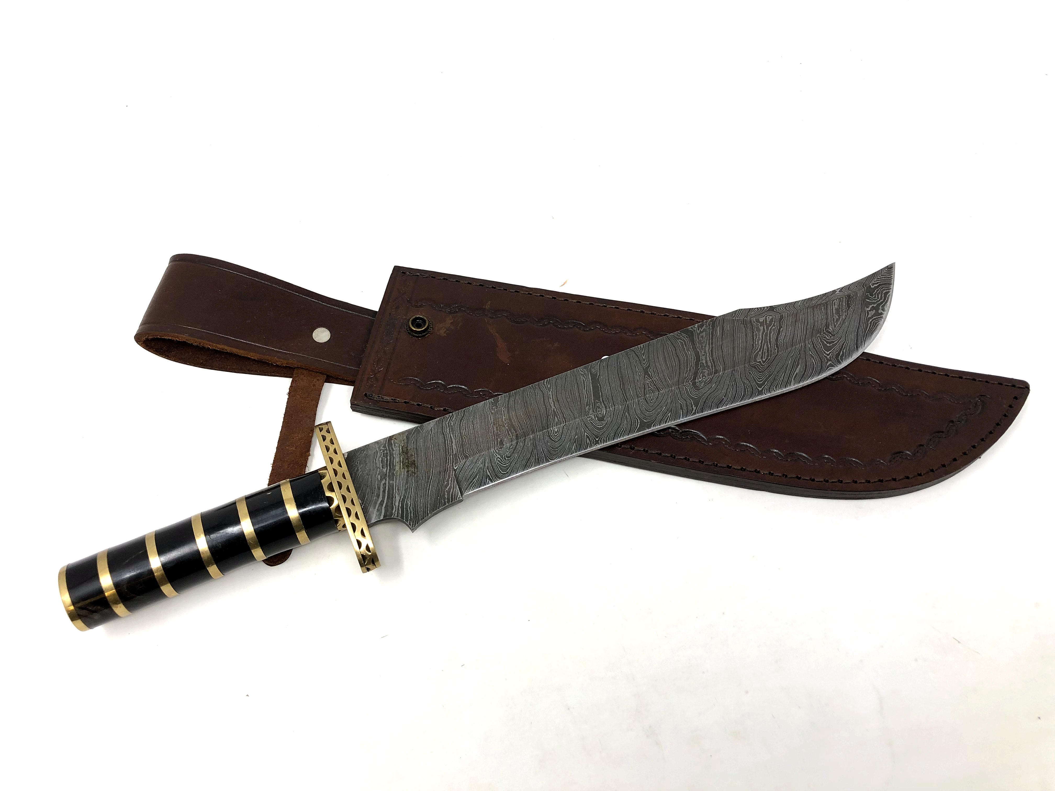 A bowie knife with pattern-welded blade, in leather sheath.