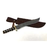 A bowie knife with pattern-welded blade, in leather sheath.