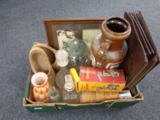 A box containing miscellaneous to include glass decanters and glass head, wooden clogs,