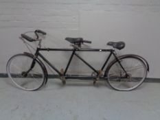 A vintage tandem bicycle with sprung seats