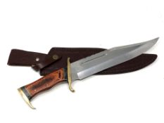 A bowie knife with brass mounted hilt,