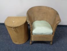 A gold Lloyd Loom armchair and matching D-shaped linen box