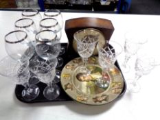 A tray of assorted wine glasses, Royal Doulton Scottish Historical Figures plate,
