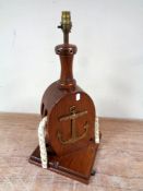 A wooden nautical-themed table lamp