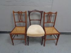 A pair of Edwardian bergere seated bedroom chairs together with a 19th century mahogany occasional