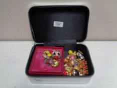 A box of Butler & Wilson costume brooches