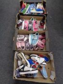 Four boxes containing a quantity of Zipz interchangeable shoes