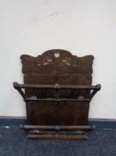 An Edwardian oak wall hanging letter rack