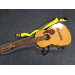 A Spanish acoustic guitar in carry bag