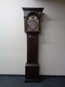 A 19th century oak longcase clock with brass dial,