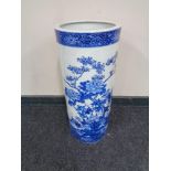 A blue and white porcelain stick pot in oriental design,