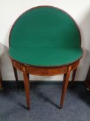 A Victorian inlaid mahogany D-shaped card table