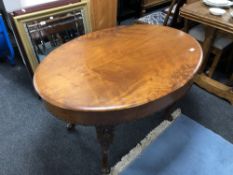 A continental carved mahogany oval occasional table