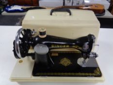 A cased Singer hand sewing machine