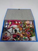 A box containing vintage Christmas tree decorations