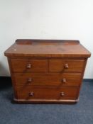 A Victorian mahogany four drawer chest