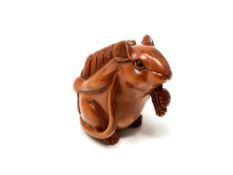 A carved Chinese hardwood netsuke - Rat holding corn