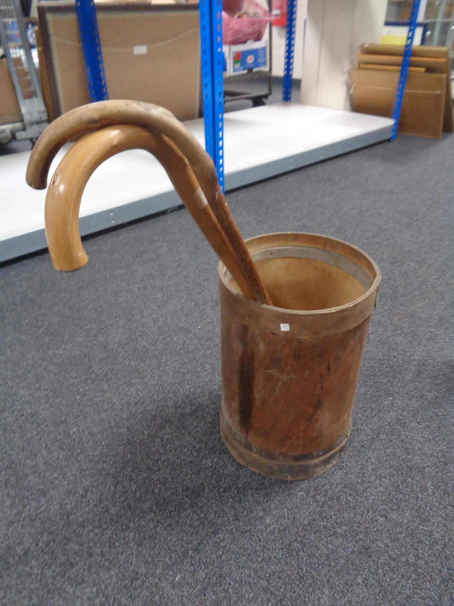 A stick pot containing two walking sticks