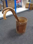 A stick pot containing two walking sticks