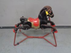 A mid 20th century Mobo tin plate rocker horse