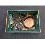 A box of antique and later metal wares to include companion set, copper muffin dish, brass trivets,