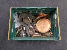 A box of antique and later metal wares to include companion set, copper muffin dish, brass trivets,