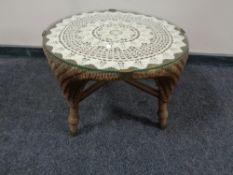 A 20th century Lloyd Loom occasional table