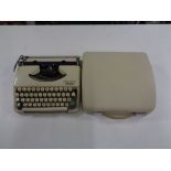 A cased vintage Olympia Splendid 33 typewriter