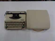 A cased vintage Olympia Splendid 33 typewriter