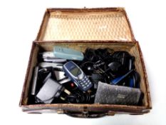 A vintage leather case containing assorted vintage mobile phones to include Nokia, Siemens, Sony,