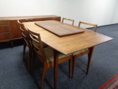 A mid 20th century McIntosh Furniture six piece dining room suite comprising low sideboard,