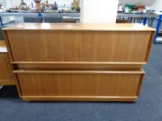 A pair of teak G Plan low sliding door sideboards, length 152.