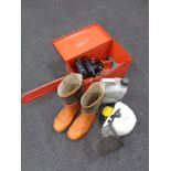 A Dolmar chain saw with spare chain in a fitted case, together with chain oil, boots, helmet,