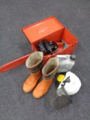 A Dolmar chain saw with spare chain in a fitted case, together with chain oil, boots, helmet,