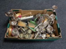 A box of early 20th century plated candelabra, egg cups on stands, plated cutlery,