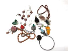 A collection of mostly white metal and silver jewellery, bangles, pendants etc.