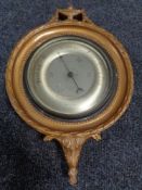 An early 20th century Gomme Furniture of Whickham barometer with silver dial in a gilt frame