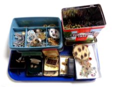 A tray containing costume jewellery to include brooches, beaded necklaces, earrings,