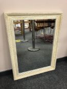 A cream bevel mirror,